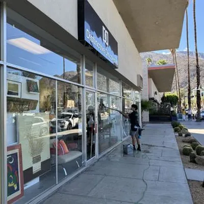 Commercial storefront window cleaning on Palm Canyon Drive